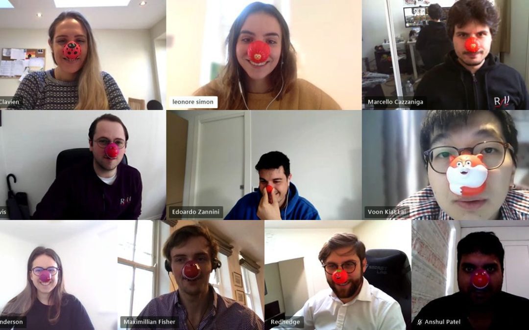 Men and women wearing red noses.