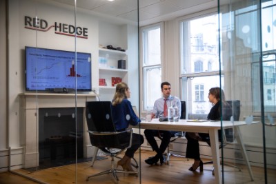 Photo of the Redhedge team in a meeting Photo of the Redhedge team in a meeting
